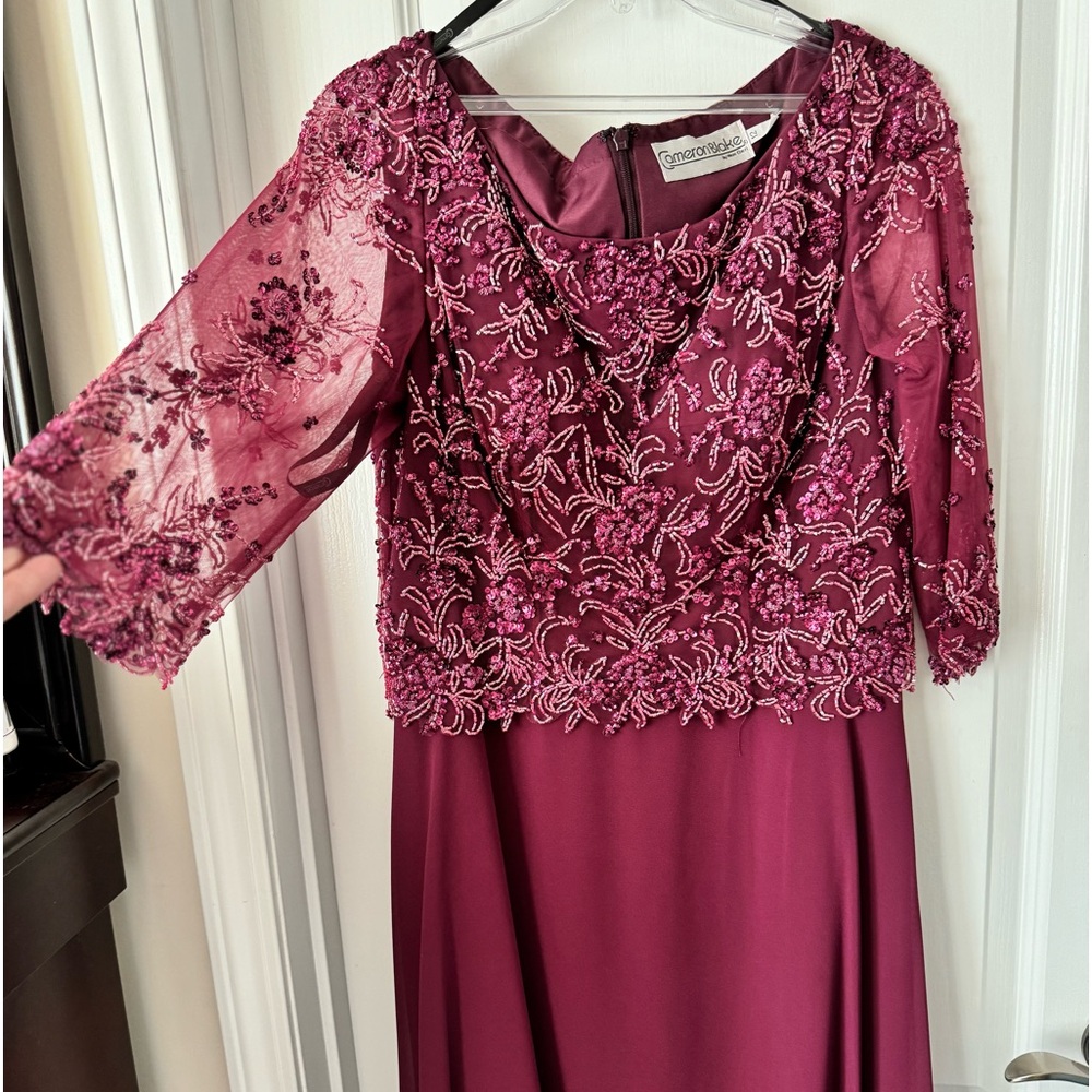 Gorgeous cranberry formal gown with beaded overlay.